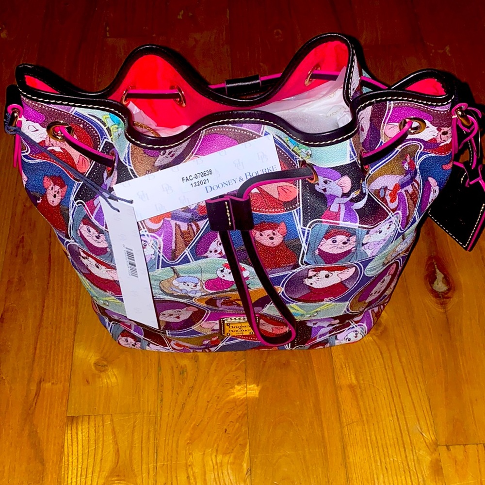 The Rescuers Dooney & Bourke Drawstring Bag brand new never used.